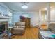 Comfortable living room with hardwood floors, fireplace, and ample seating at 2201 Valley Creek Cir, Snellville, GA 30078