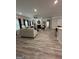 Open concept living room with fireplace, luxury vinyl plank flooring, and neutral paint at 3006 Fairway Dr, Villa Rica, GA 30180
