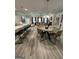Open-concept living space featuring a gourmet kitchen, dining area, and a living room at 3006 Fairway Dr, Villa Rica, GA 30180