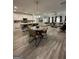 Open-concept living space boasts a modern kitchen with an island, a dining area, and comfortable living room at 3006 Fairway Dr, Villa Rica, GA 30180