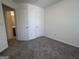 Bedroom featuring entrances to a closet and bathroom at 7090 E Village Ct, Riverdale, GA 30296
