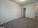 Bedroom with carpet and a closet and bathroom entrance at 7090 E Village Ct, Riverdale, GA 30296