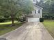 Charming two-story home with a two-car garage and well-maintained lawn at 7090 E Village Ct, Riverdale, GA 30296