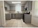 Well-lit kitchen with stainless steel appliances, granite countertops, and updated cabinetry at 7090 E Village Ct, Riverdale, GA 30296