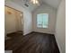 Cozy living room with hardwood floors, a ceiling fan, and natural light at 7090 E Village Ct, Riverdale, GA 30296