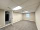 Finished basement providing additional living space with carpet flooring and ample room at 6309 Wellington Way, Austell, GA 30106