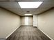 Spacious finished basement with neutral walls and carpet flooring, offering versatility at 6309 Wellington Way, Austell, GA 30106