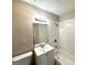 Clean and functional bathroom with a shower-tub combination and classic white fixtures at 6309 Wellington Way, Austell, GA 30106