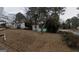 Charming single-story home with a welcoming screened front porch and a yard covered in fallen leaves at 2010 Mcafee Pl, Decatur, GA 30032