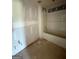 Unfinished bathroom featuring a tub and open plumbing for toilet and sink at 242 Old Jackson Rd, Mcdonough, GA 30252