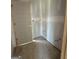 Small unfinished bathroom featuring an open door and rough plumbing at 242 Old Jackson Rd, Mcdonough, GA 30252