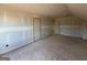 Unfinished bedroom featuring three doors and exposed subflooring at 242 Old Jackson Rd, Mcdonough, GA 30252