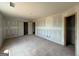 Large unfinished bedroom with multiple doorways and neutral walls at 242 Old Jackson Rd, Mcdonough, GA 30252