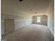 Unfinished bedroom with a window and an alcove for a closet at 242 Old Jackson Rd, Mcdonough, GA 30252