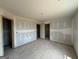 Spacious unfinished bedroom featuring multiple closets and doorways at 242 Old Jackson Rd, Mcdonough, GA 30252