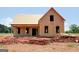 Unfinished home featuring a gable roof, window openings, and a partially covered front porch at 242 Old Jackson Rd, Mcdonough, GA 30252