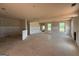 Large, unfinished living room area with multiple windows providing ample natural light in a new home at 242 Old Jackson Rd, Mcdonough, GA 30252