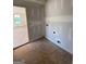 Unfinished room with neutral walls, natural light, and open doorway at 242 Old Jackson Rd, Mcdonough, GA 30252