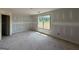 Bright unfinished room with natural light streaming through the window at 242 Old Jackson Rd, Mcdonough, GA 30252
