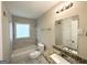 Updated bathroom featuring a granite vanity, tile shower, and modern fixtures at 2851 Mitchell Dr, Decatur, GA 30032