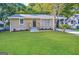 Charming single-story brick home featuring a well-manicured lawn and welcoming front entrance at 2851 Mitchell Dr, Decatur, GA 30032