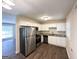 Updated kitchen featuring white cabinets, granite countertops, stainless steel appliances, and stylish flooring at 2851 Mitchell Dr, Decatur, GA 30032