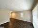 Spacious living room featuring hardwood floors, neutral walls, and plenty of natural light at 2851 Mitchell Dr, Decatur, GA 30032