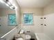 Bright bathroom with white tile, updated vanity, and combined shower and tub at 2215 Rosewood Rd, Decatur, GA 30032