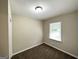 Bright bedroom featuring neutral walls and a window at 2215 Rosewood Rd, Decatur, GA 30032