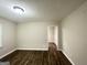 A spacious living room with hardwood floors and neutral-colored walls at 2215 Rosewood Rd, Decatur, GA 30032