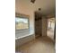 Primary bathroom features a tub, shower, and natural light from a window at 252 Old Jackson Rd, Mcdonough, GA 30252