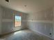 Bedroom features a window with great sunlight and unfinished construction at 252 Old Jackson Rd, Mcdonough, GA 30252
