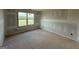 Unfinished bedroom featuring a window with natural light and neutral walls at 252 Old Jackson Rd, Mcdonough, GA 30252