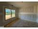 Unfinished bedroom with a large window and ample natural light, perfect for customization at 252 Old Jackson Rd, Mcdonough, GA 30252