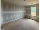 Bedroom features a window with great sunlight and unfinished construction at 252 Old Jackson Rd, Mcdonough, GA 30252