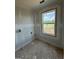 Unfinished bedroom with a window view, showcasing the natural light and simple design at 252 Old Jackson Rd, Mcdonough, GA 30252