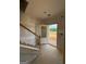 Bright entryway with stairs and an open door, creating a welcoming and accessible entrance at 252 Old Jackson Rd, Mcdonough, GA 30252