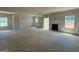 Open-concept living room with large windows and door frames, ready for personalization and design at 252 Old Jackson Rd, Mcdonough, GA 30252