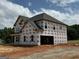 New two-story home with black roof and multiple windows wrapped in Tech-Wrap at 252 Old Jackson Rd, Mcdonough, GA 30252