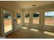 Bright sunroom with multiple windows and a door, offering natural light and outdoor access at 252 Old Jackson Rd, Mcdonough, GA 30252