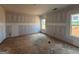 Unfinished room with two windows at 1916 King Mill Rd, Mcdonough, GA 30252