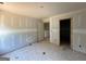 Bedroom with a walk-in closet and doorway to another room, ready to customize at 1916 King Mill Rd, Mcdonough, GA 30252