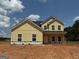 New two-story home featuring board and batten siding and black roof at 1916 King Mill Rd, Mcdonough, GA 30252