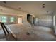 Large open-concept living room featuring an unfinished staircase at 1916 King Mill Rd, Mcdonough, GA 30252