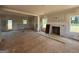 Open-concept living area with fireplace and access to back patio at 1916 King Mill Rd, Mcdonough, GA 30252