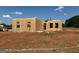New home is under construction with wood framing and a blue sky on a large lot at 1916 King Mill Rd, Mcdonough, GA 30252