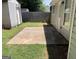 A backyard features a concrete patio, well-maintained lawn, and a shed that offer storage at 6372 Stonebridge Creek Ln, Lithonia, GA 30058
