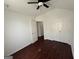 Bedroom with neutral walls, wood-look flooring, a double closet and a door to another room at 6372 Stonebridge Creek Ln, Lithonia, GA 30058
