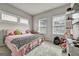 Cozy bedroom with lots of natural light, featuring a bed, desk and furry rug at 4760 Highside Way, Smyrna, GA 30082
