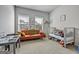 Bright bedroom with two windows, a play table, a sofa and a baby crib at 4760 Highside Way, Smyrna, GA 30082